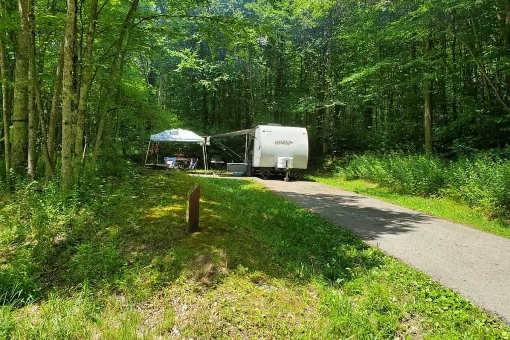 Camper parked at camp site.