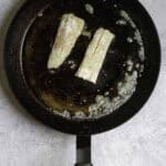 fish fillets in a pan with butter.