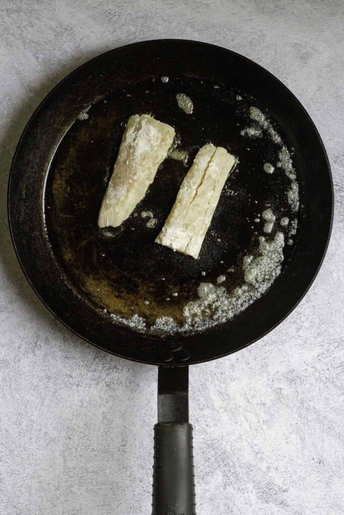 fish fillets in a pan with butter.
