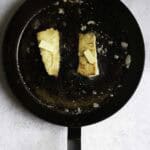 fish fillets in a pan with butter.