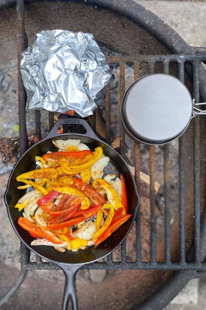 Add Veggies, Beans + Tortillas to a Campfire Grate.