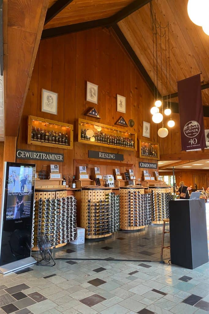 Interior of Wagner Vineyards building with racks of wine for sale
