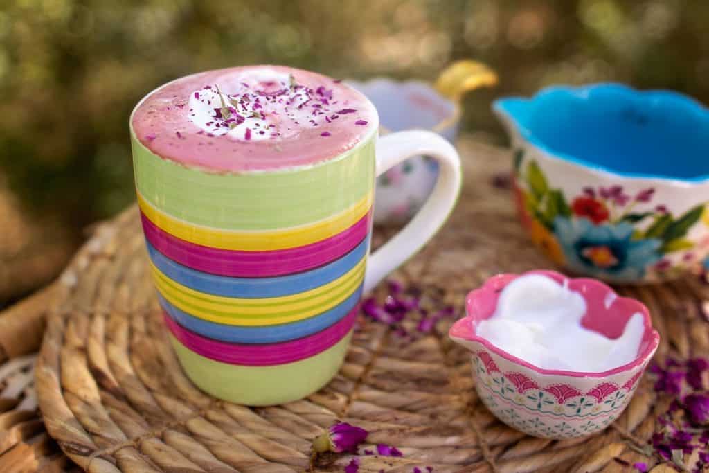 beet latte with rose flavoring in cup