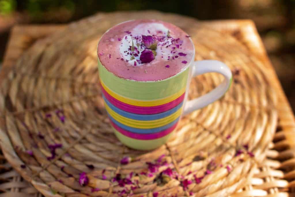 beet latte with rose flavoring in cup