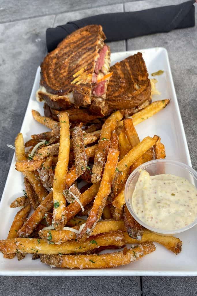Triple P Sandwich and fries on a plate.
