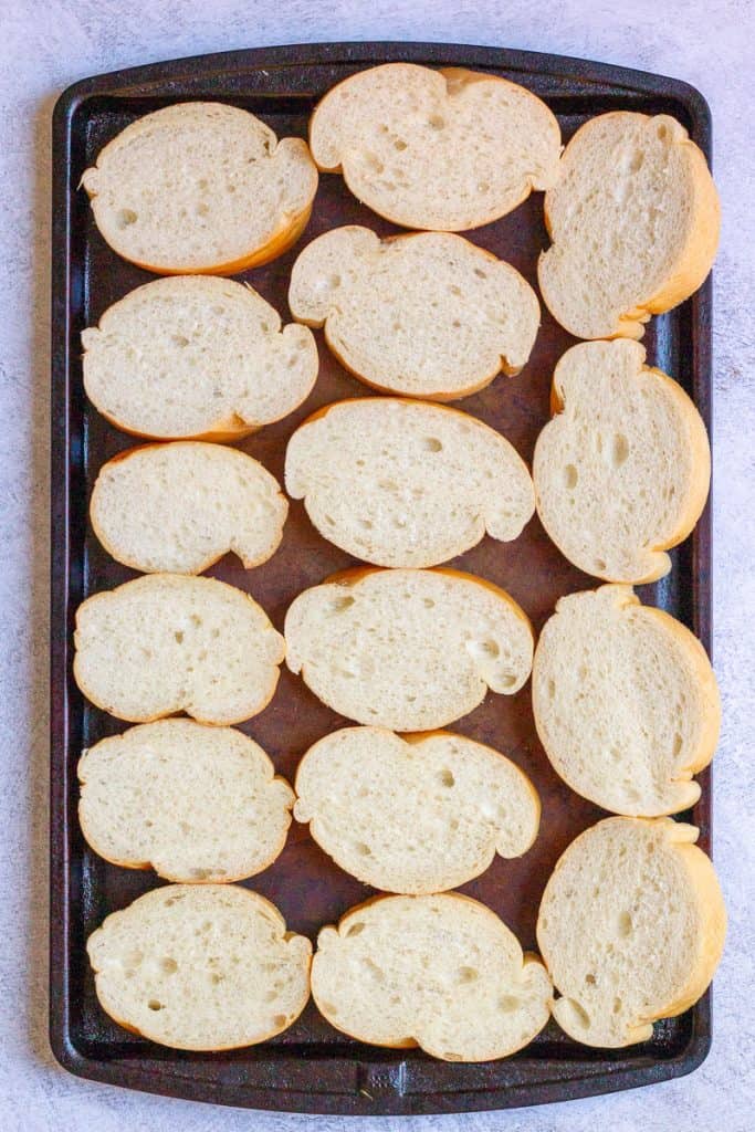 Bread arranged on a baking sheet.