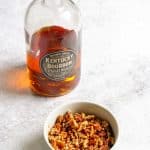 bowl of chopped pecans with bourbon.