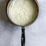 cooked jasmine rice in a saucepan.