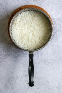 cooked jasmine rice in a saucepan.