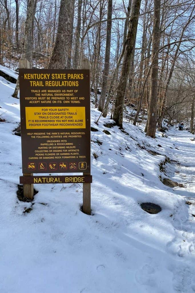 Sign with Kentucky State Parks trail regulations at beginning of trailhead.