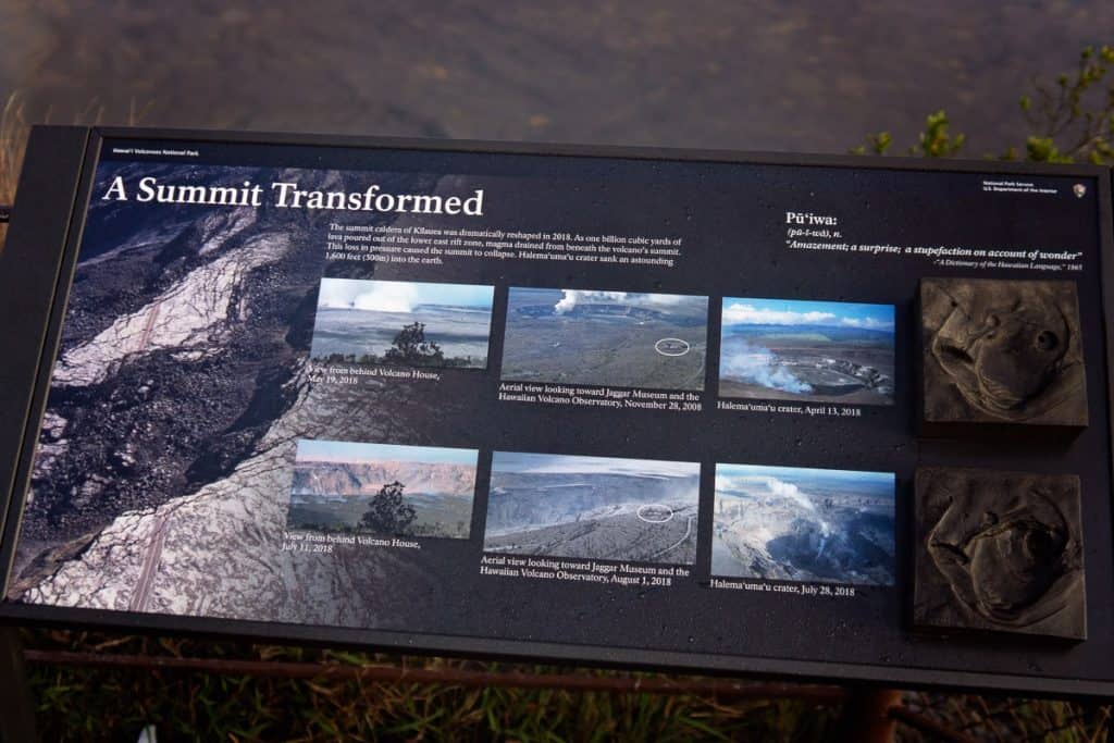 Sign reading "A Summit Transformed" with volcano photos.