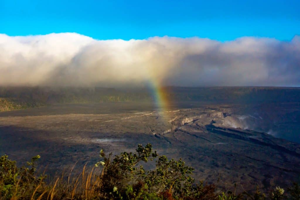 Rainbow over Kīlauea Caldera in Hawaii Volcanoes National Park.