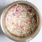 chopped red onion in a stockpot.