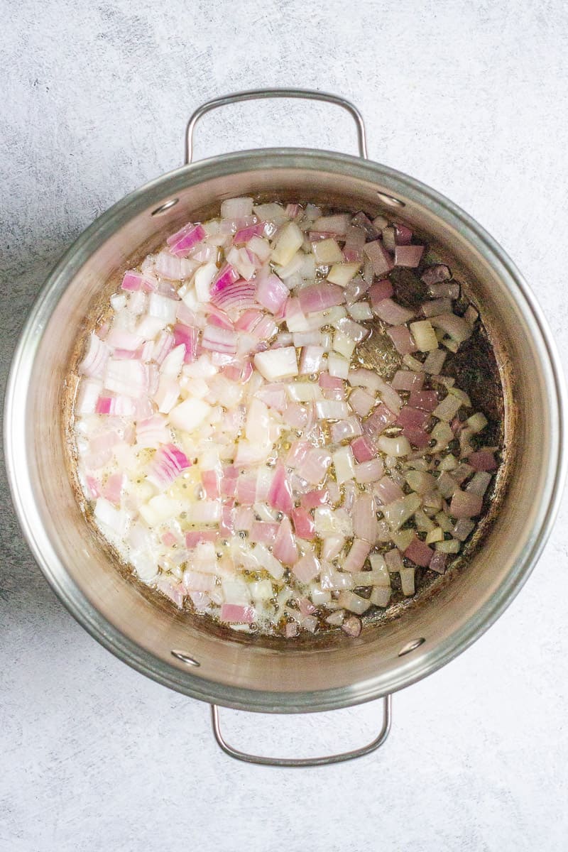chopped red onion in a stockpot.