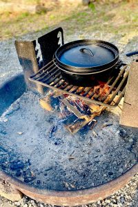 Dutch oven on campfire grate.