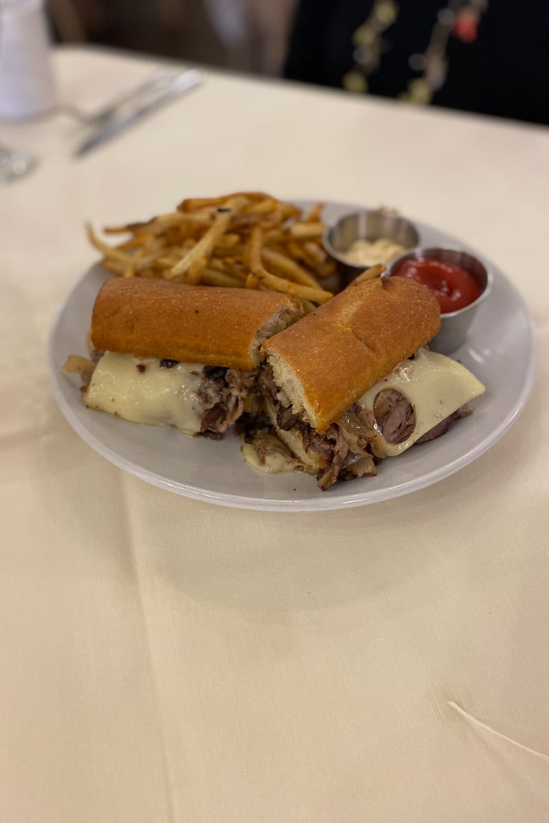 Smoked brisket baguette and fries.
