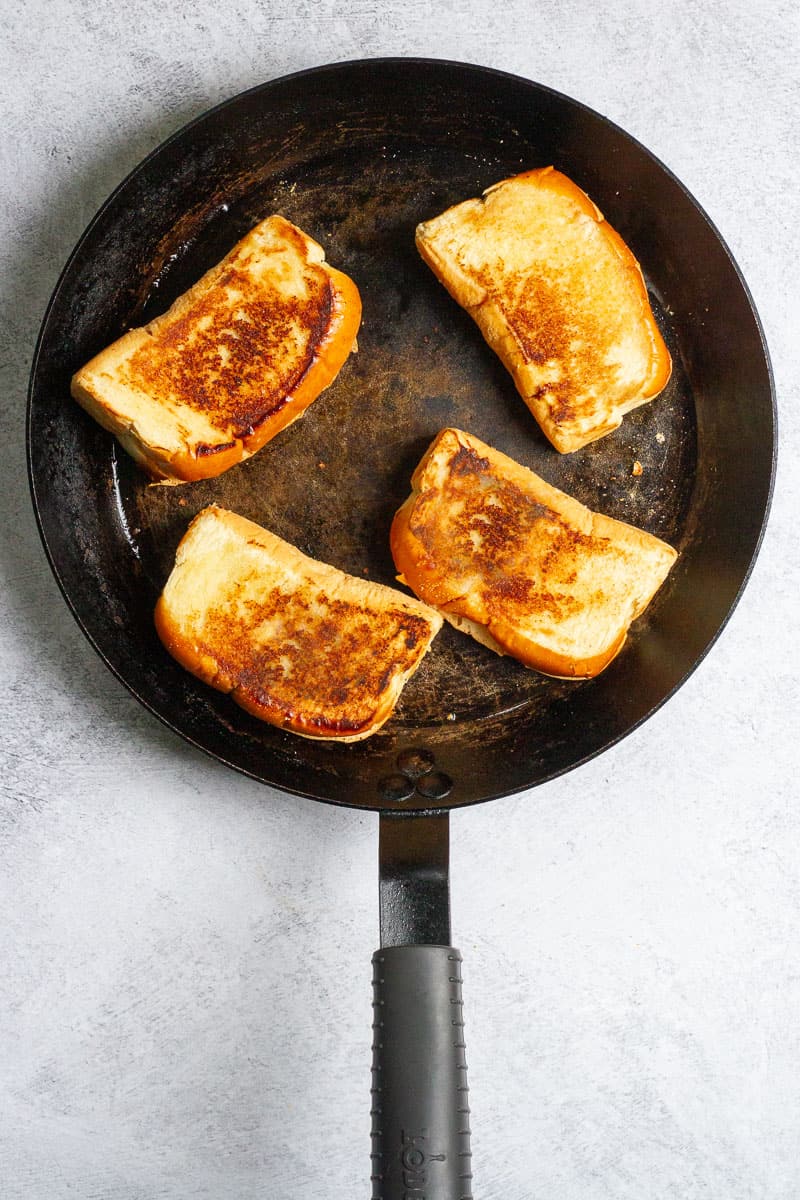golden toasted buns in a pan.