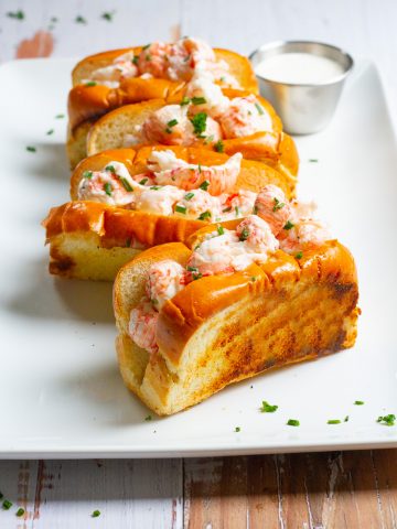 langostino lobster rolls on a serving tray.