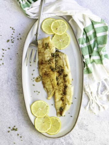 pan-seared hake on platter.
