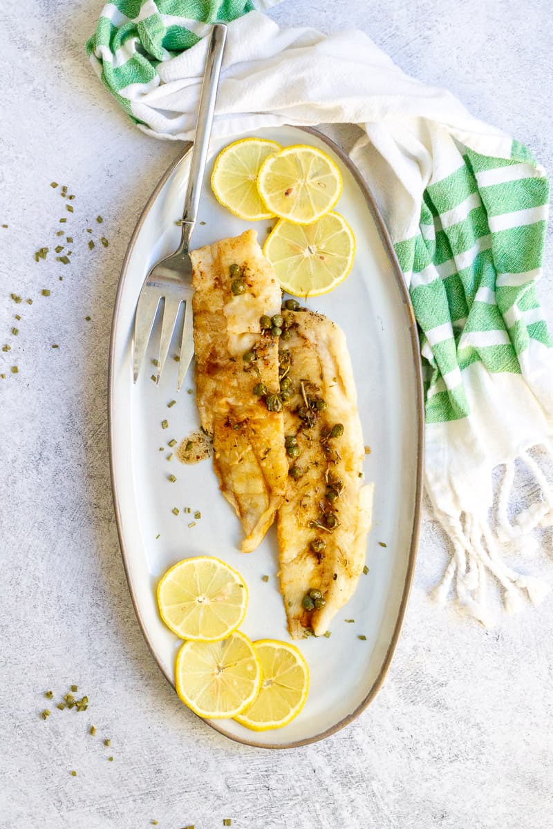 pan-seared hake on a serving tray.