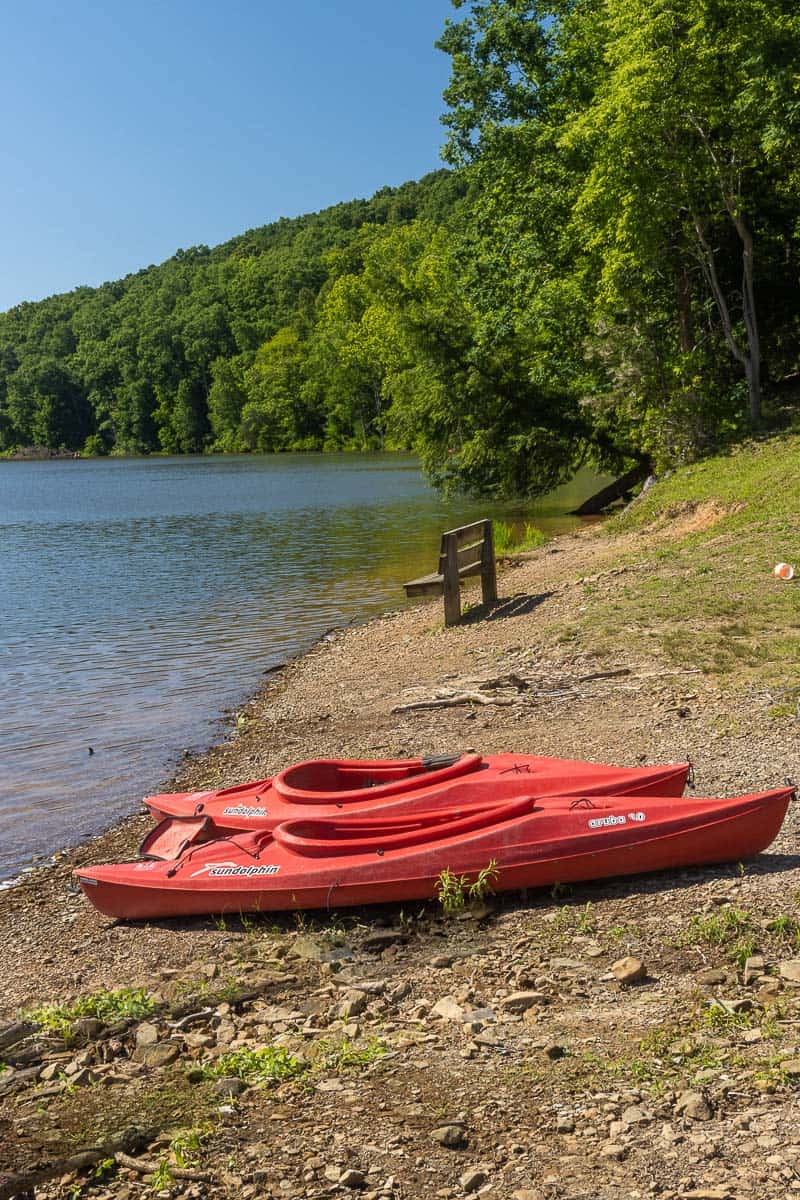 Kayaks on bank of lake at Shawnee State Park.