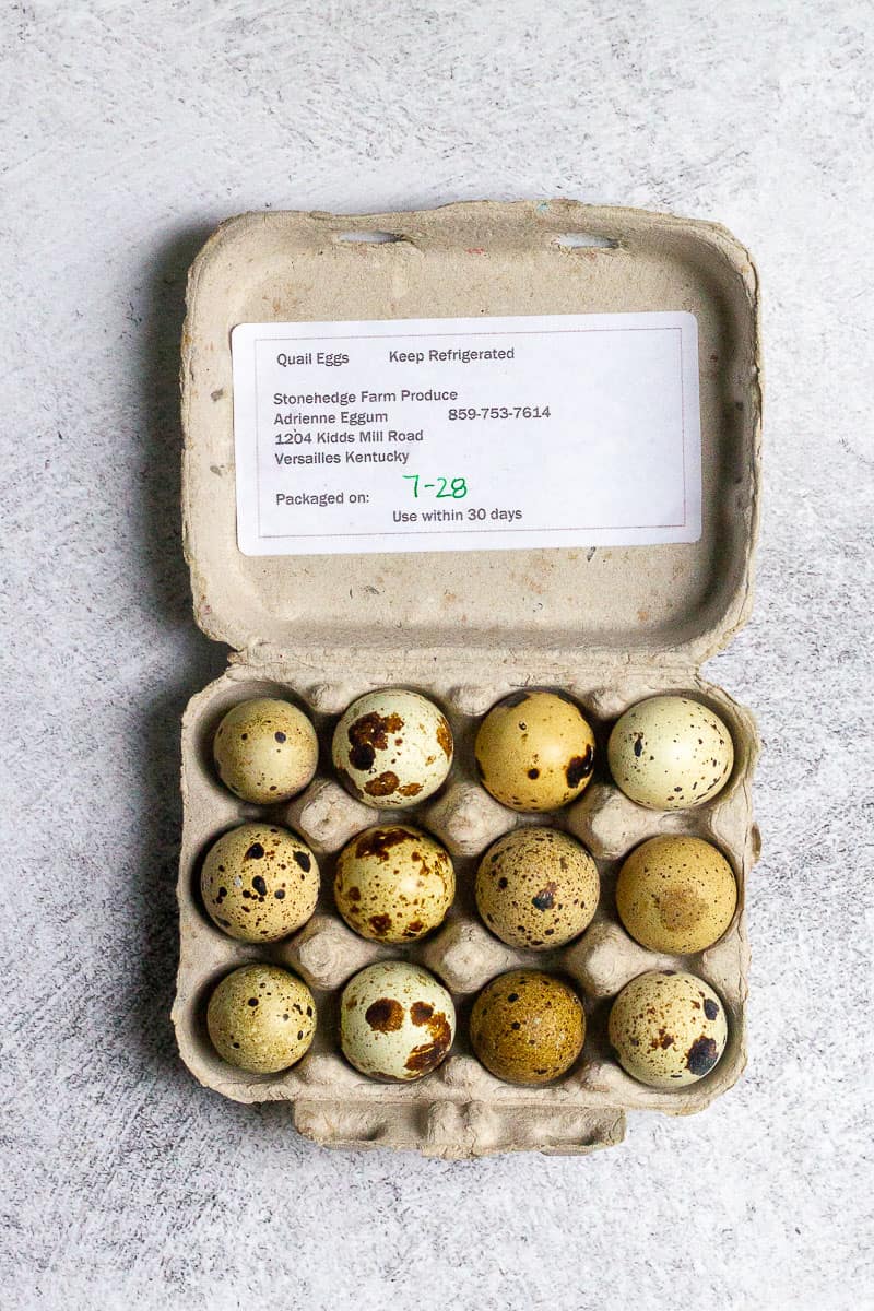 Carton of a dozen quail eggs.