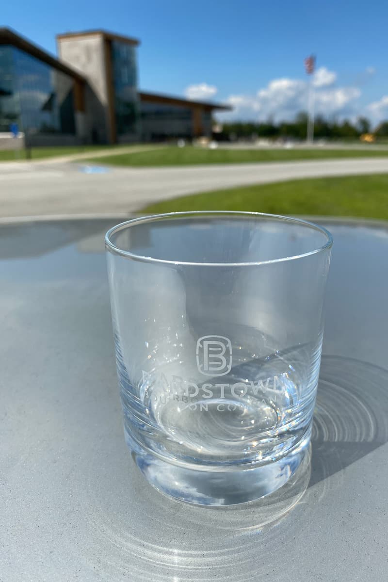 Souvenir bourbon glass with Bardstown Bourbon Company in background.