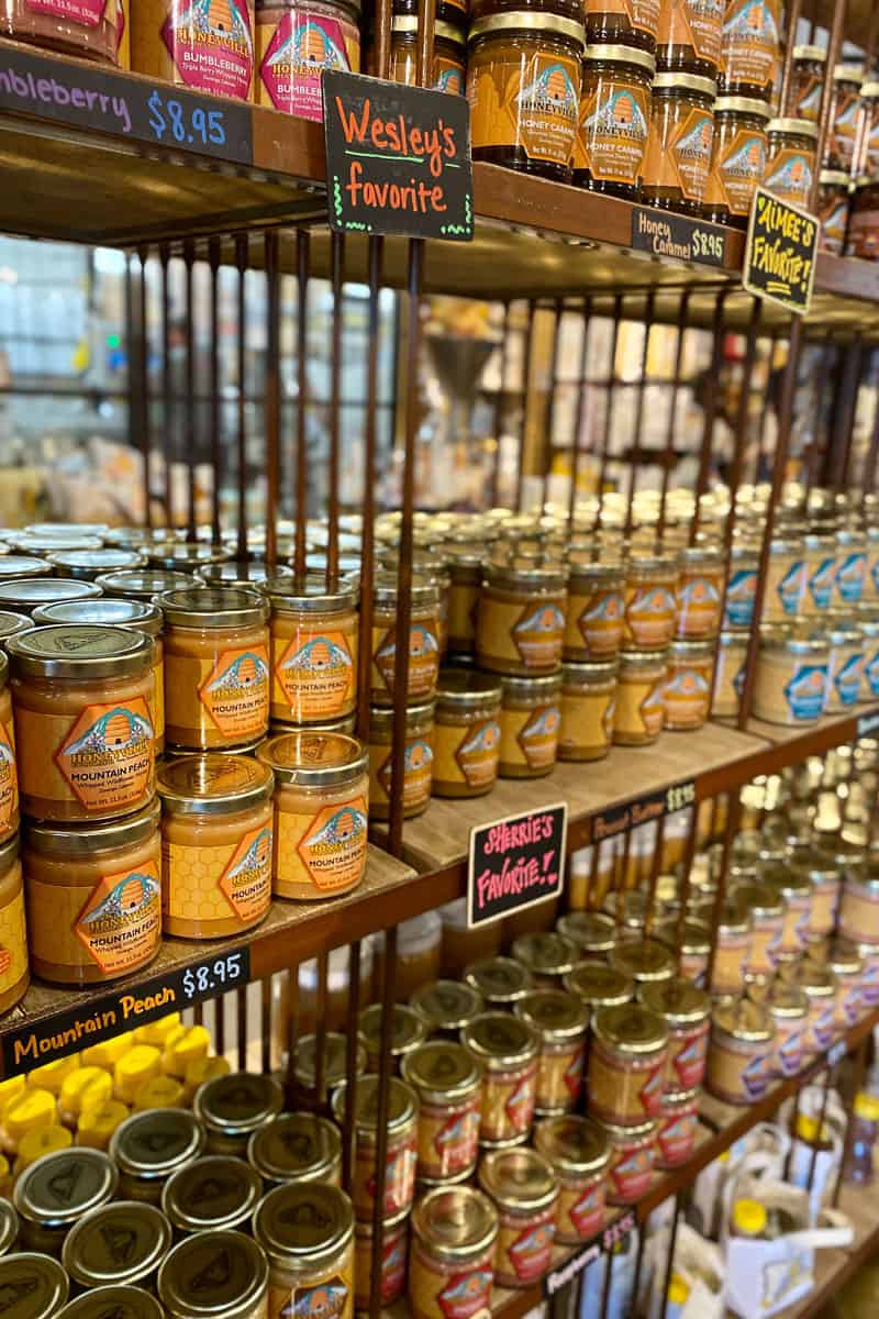 Jars of flavored honey for sale at Honeyville.