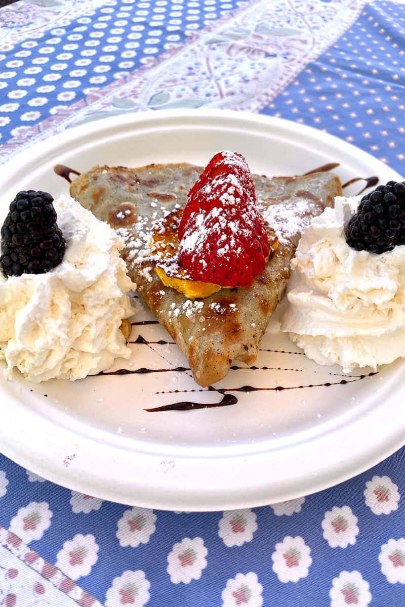 Grand Marnier crepe with strawberries, blackberries, and whipped cream.