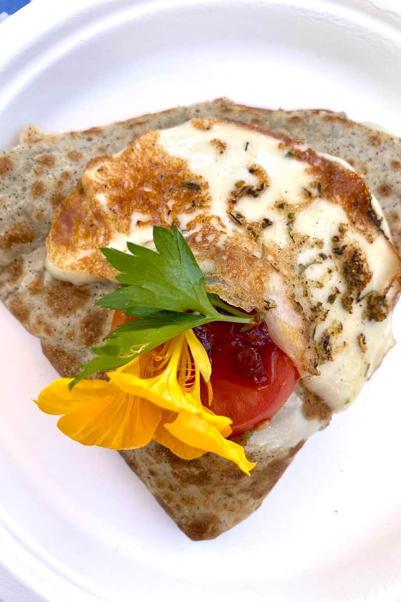 Turkey lingonberry crepe with yellow flower on top.