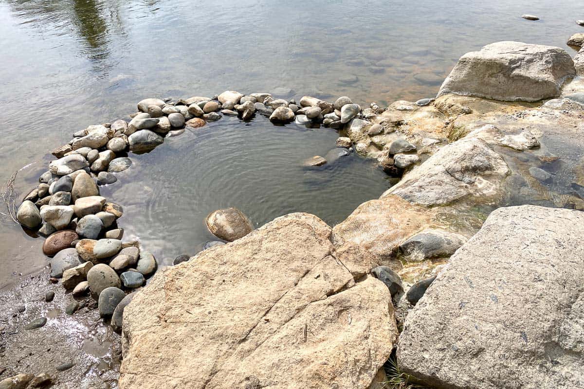 Free hot springs in river.