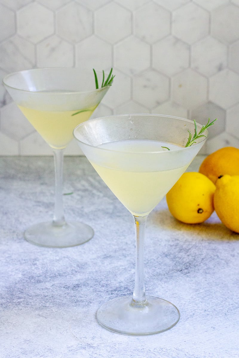 Rosemary bees knees cocktails in martini glasses.