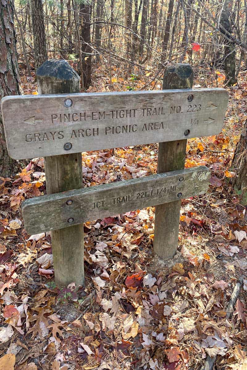 Wooden sign for Grays Arch picnic area or Pinch-em-tight Trail.