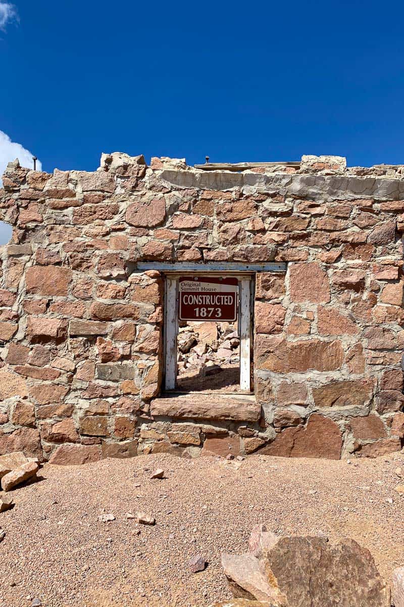 Stone ruin with sign saying, "Original summit house constructed 1873."