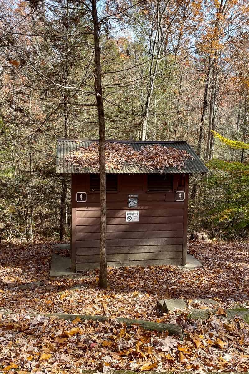 Small wooden vault toilet facility at Koomer Ridge Campground.