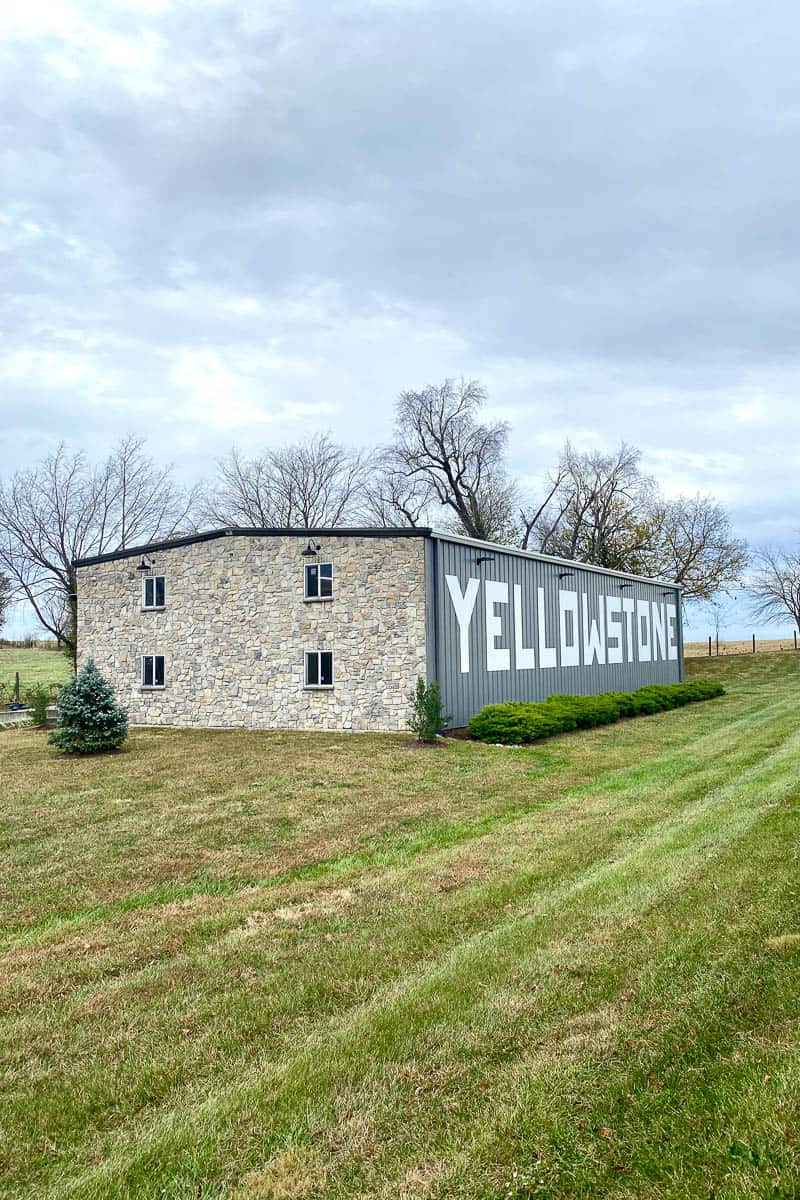 Bourbon rickhouse with "Yellowstone" painted on its side.