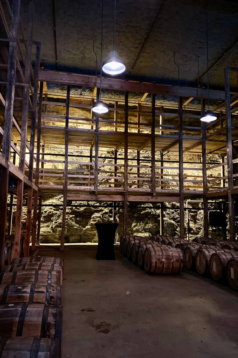 Barrels lining floor of limestone cellar seen on Makers Mark Ambassador Tour.
