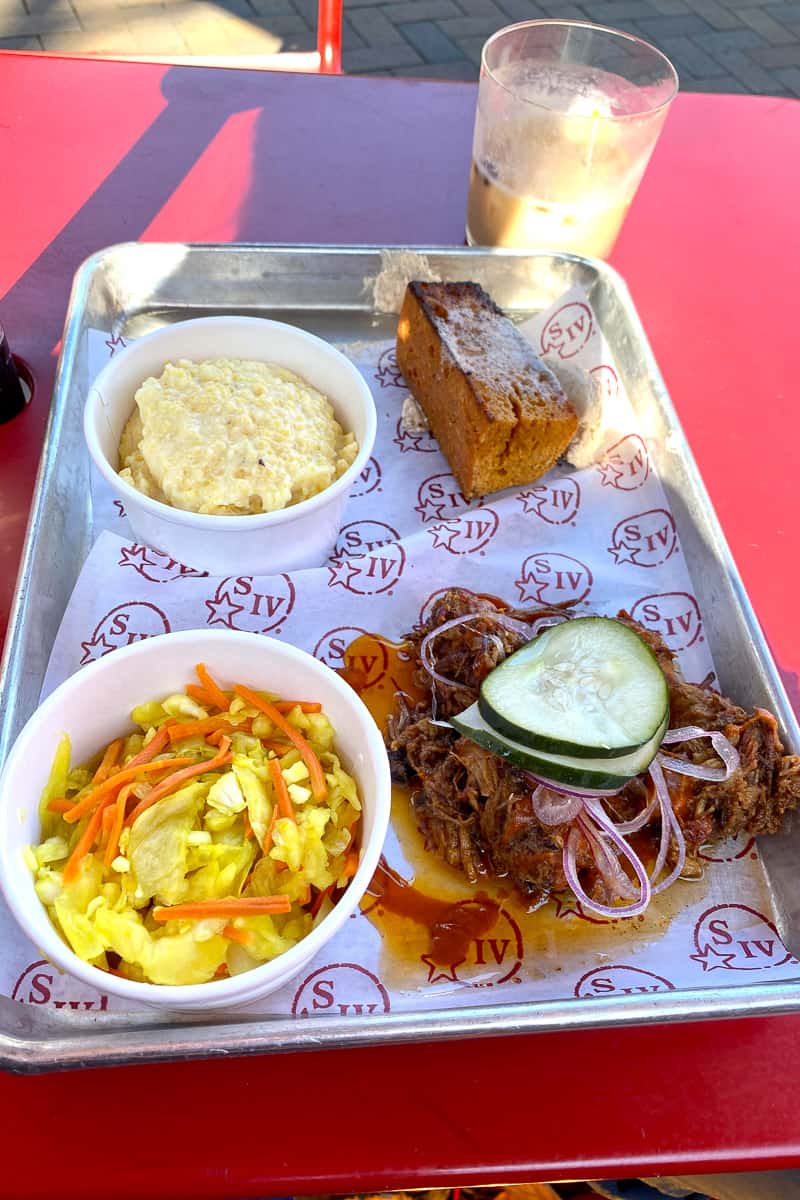Barbecue, smoked gouda grits, pickled veggie slaw, and cornbread.