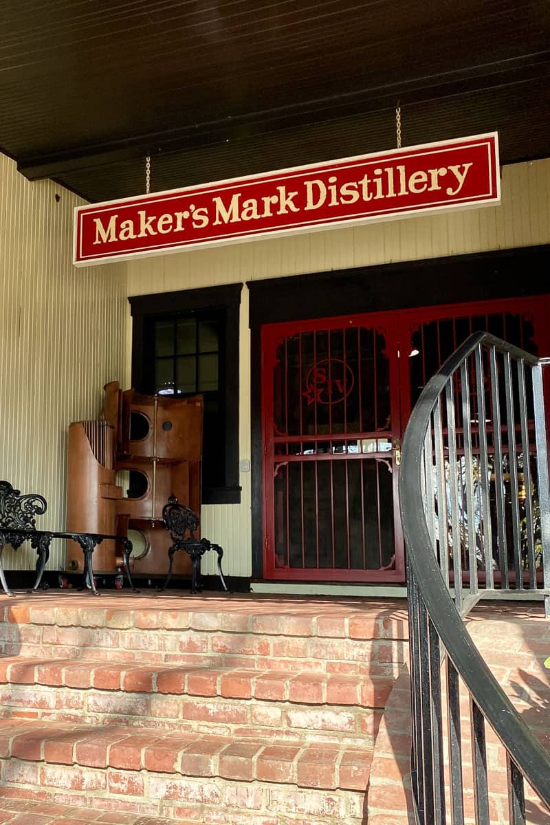 Sign at top of brick steps saying "Maker's Mark Distillery."