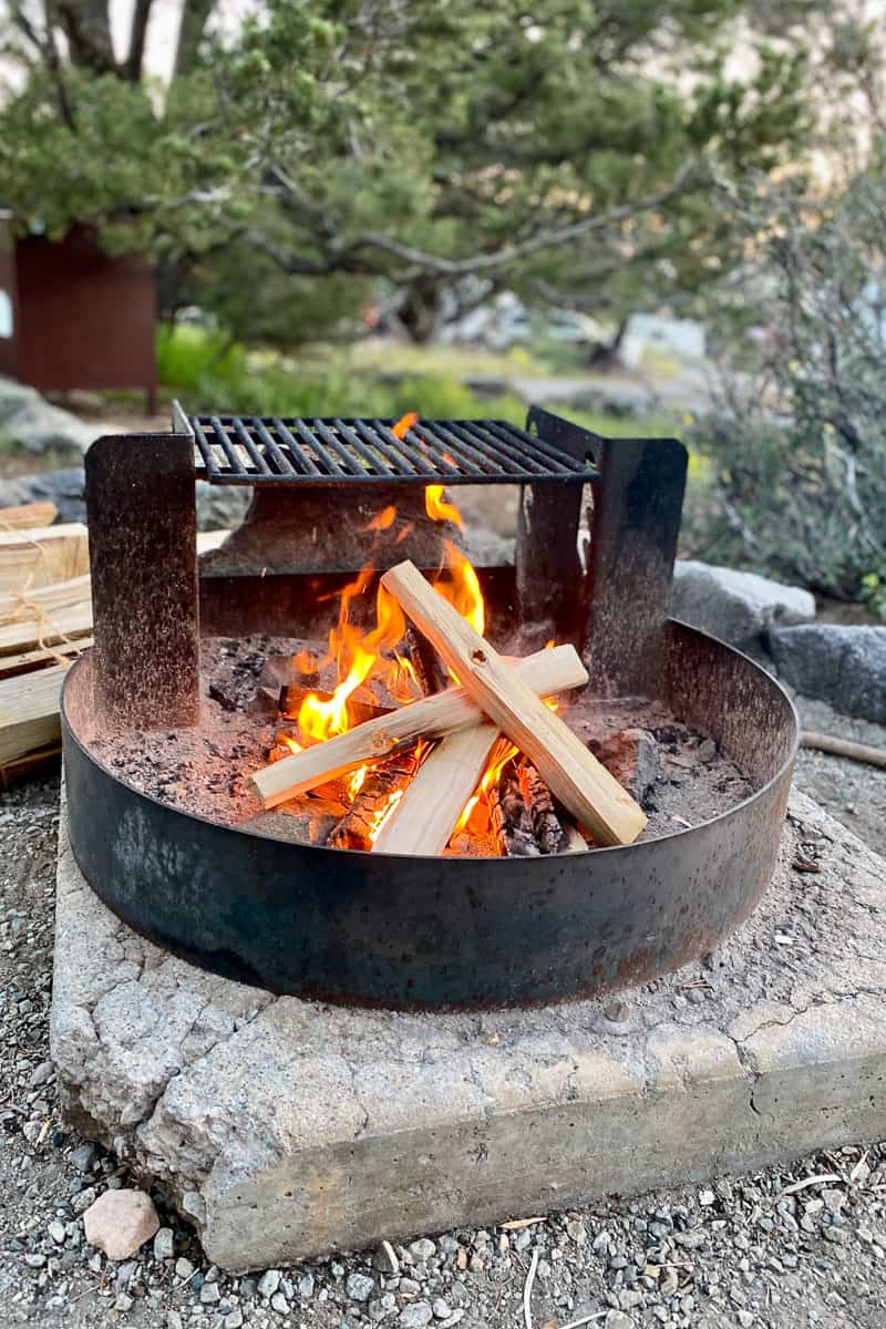 Campfire in a metal ring.