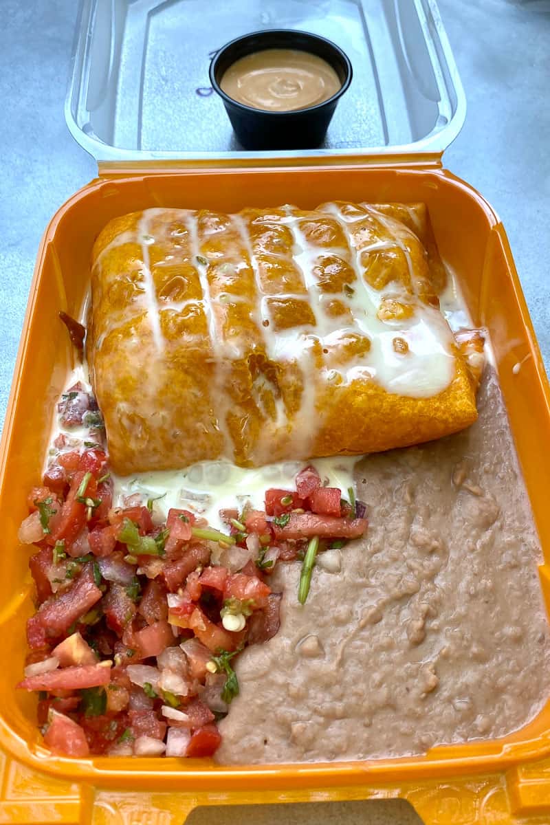 Shrimp chimichangas with pico de gallo and refried beans.