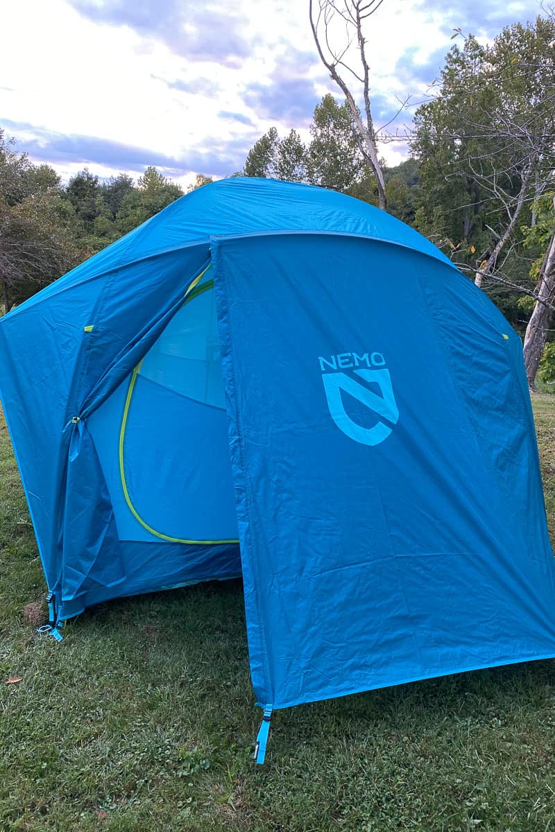 Blue dome tent with "Nemo" printed on the side.
