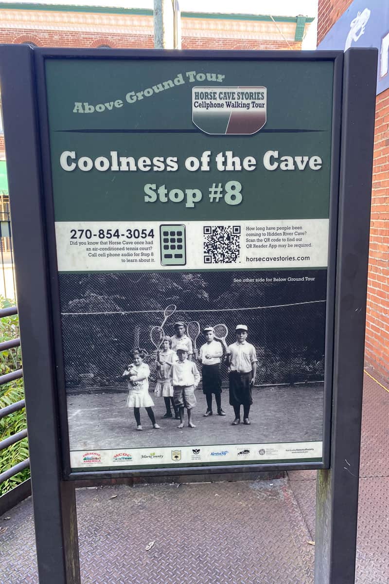 Sign for cell phone tour stop about the coolness of the cave.