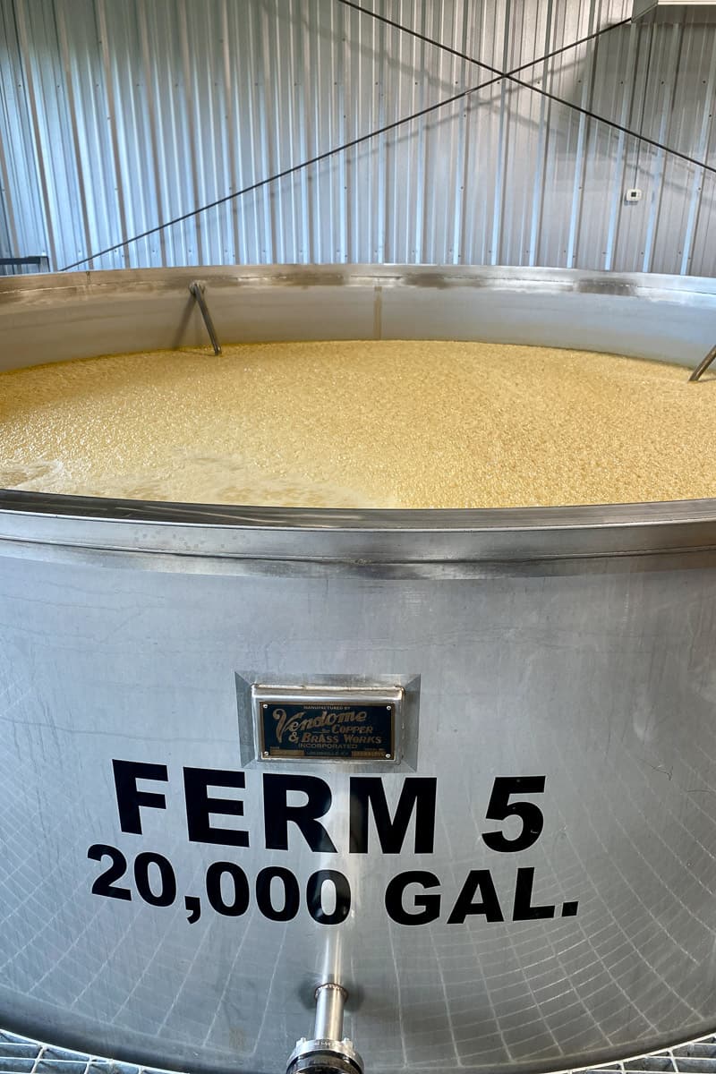 Fermenting vat labeled on the side for 20,000-gallon capacity.