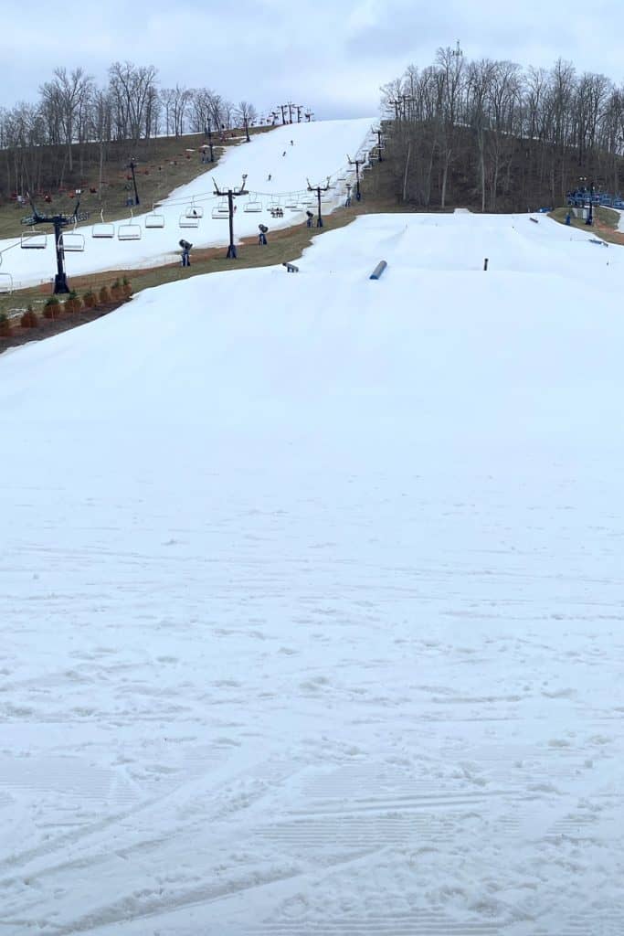 Ski runs on hill with chair lift at Perfect North Slopes.