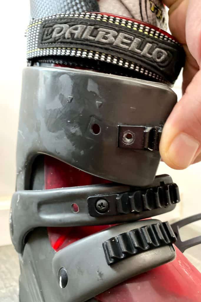 Adjusting straps on Dalbello ski boots.