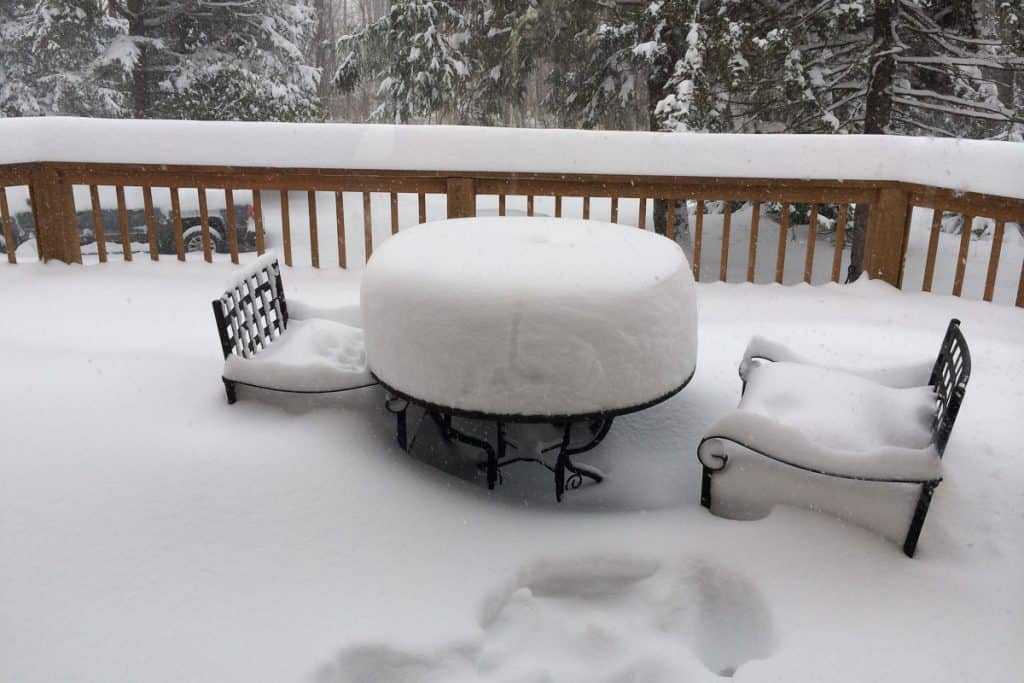 Very deep snowfall on deck, table and chairs at Canaan Valley.