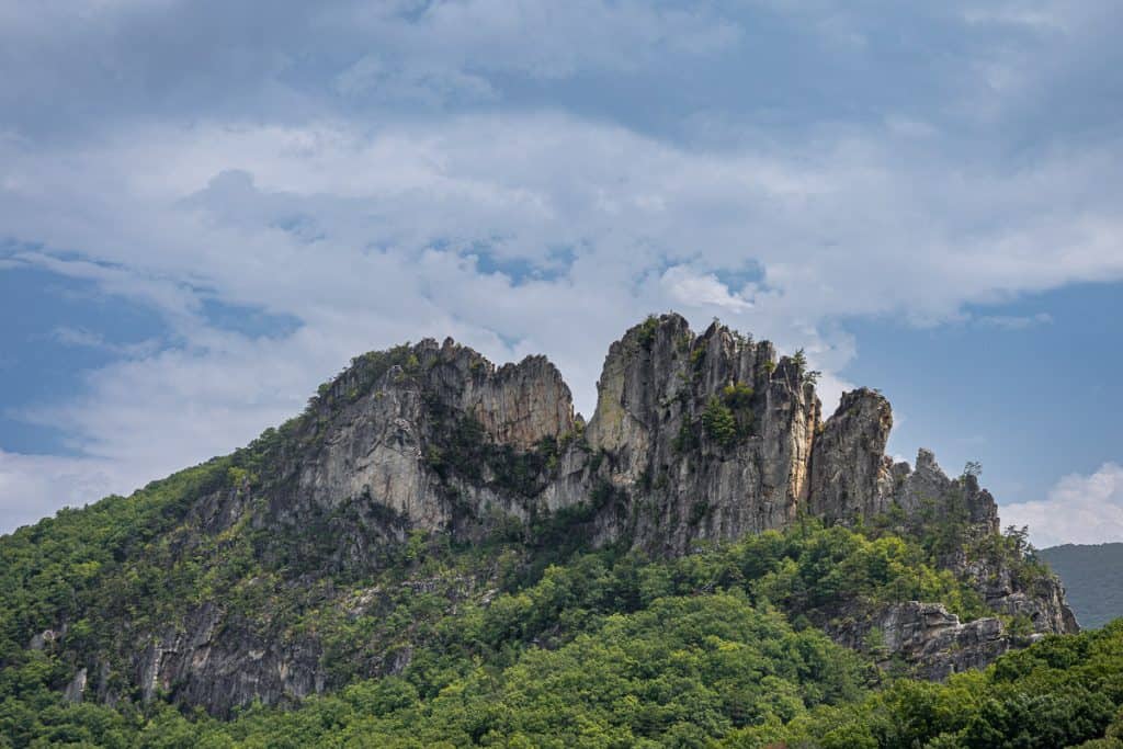 Seneca Rock, a craggy formation jutting out of hillside.