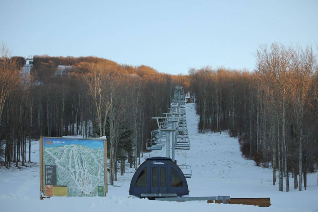 Ski lift viewed from bottom of hill.