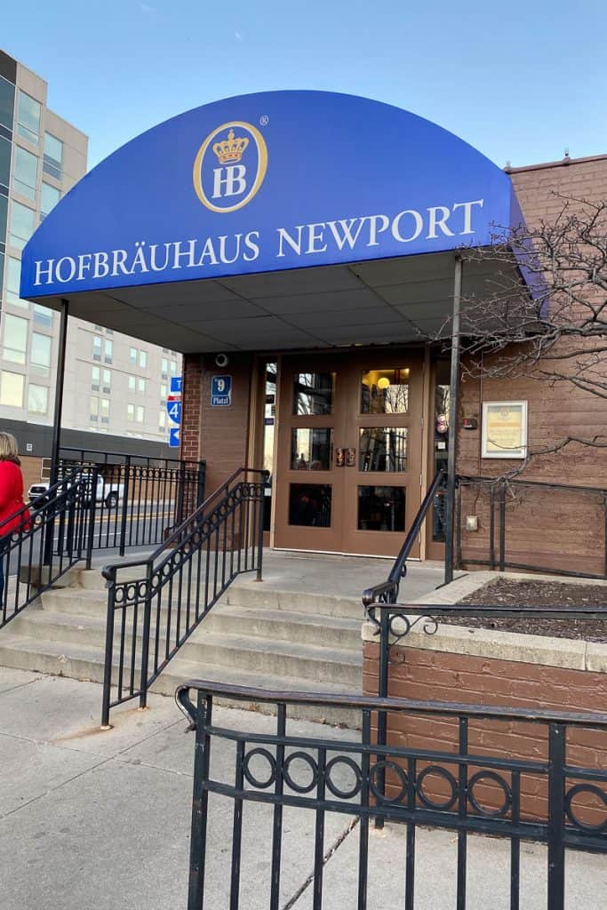 Restaurant entrance with blue awning labeled "Hofbrauhaus Newport."